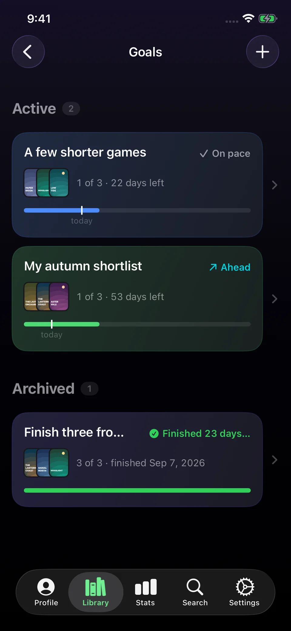 Goals in dark mode with two active goals showing progress and pace, and one completed goal.